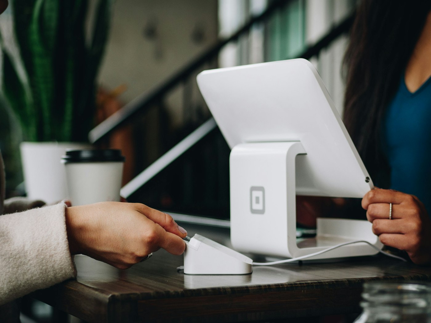Business owner handling a customer transaction